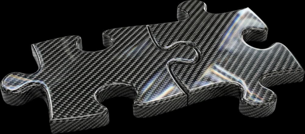 Three interlocking carbon fibre jigsaw pieces